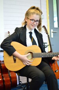 student with guitar